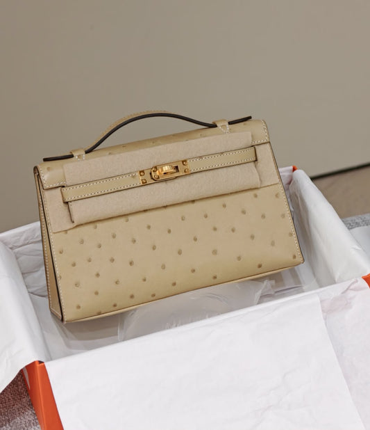 Hermes Kelly pochette trench ostrich gold hardware