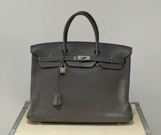Hermès Birkin handbag in dark grey grained leather with palladium padlock, turn lock and two rolled top handles