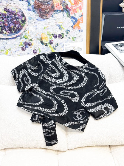 Chanel 25M black floral top