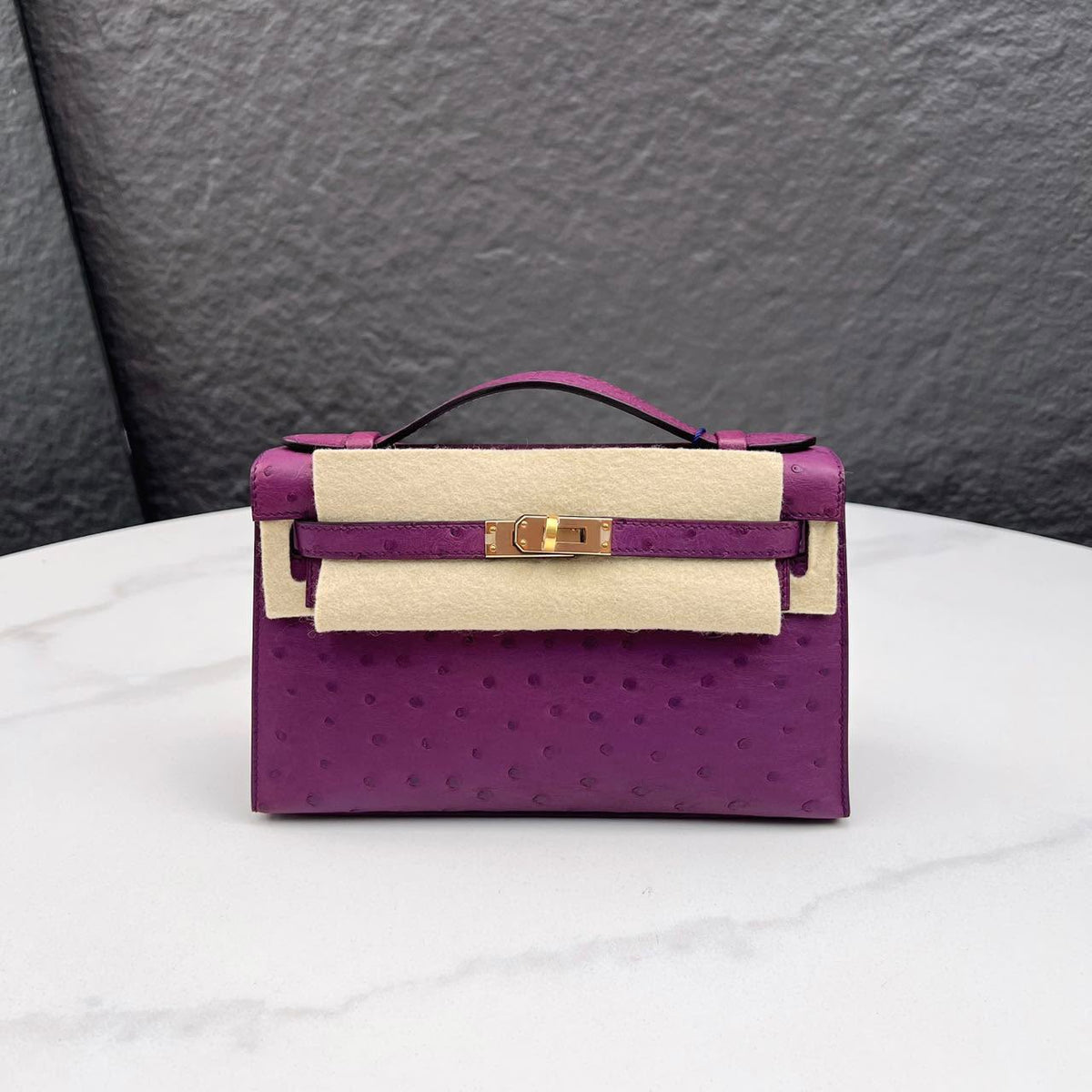 Hermes Kelly pochette Anemone Ostrich Gold hardware