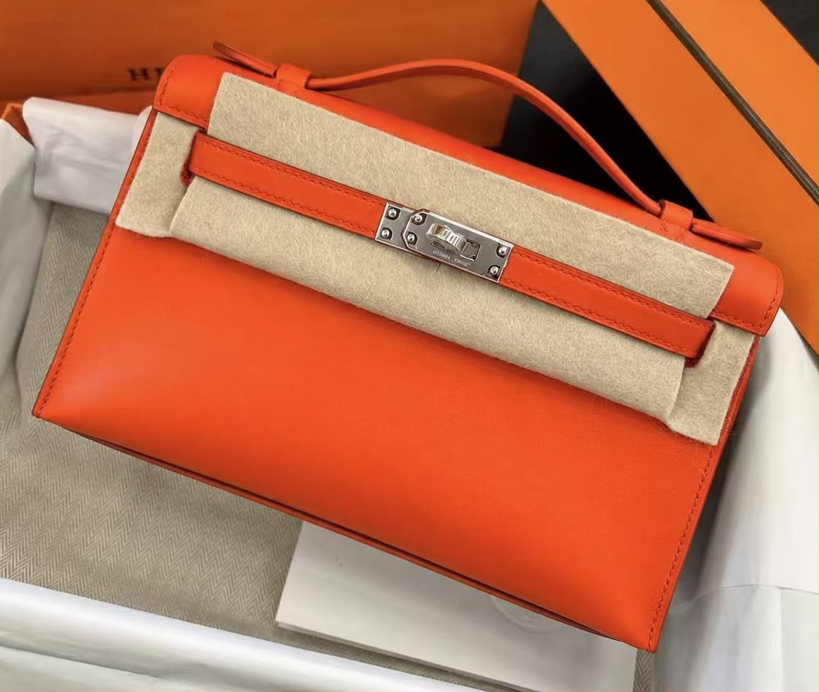 Hermes Kelly pochette Tangerine Swift Palladium hardware