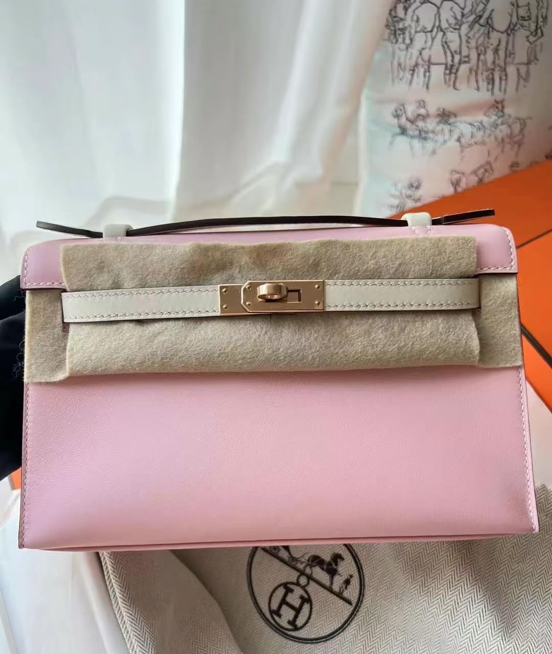 Hermes Kelly pochette Rose Sakura / Craie Swift Permabrass hardware