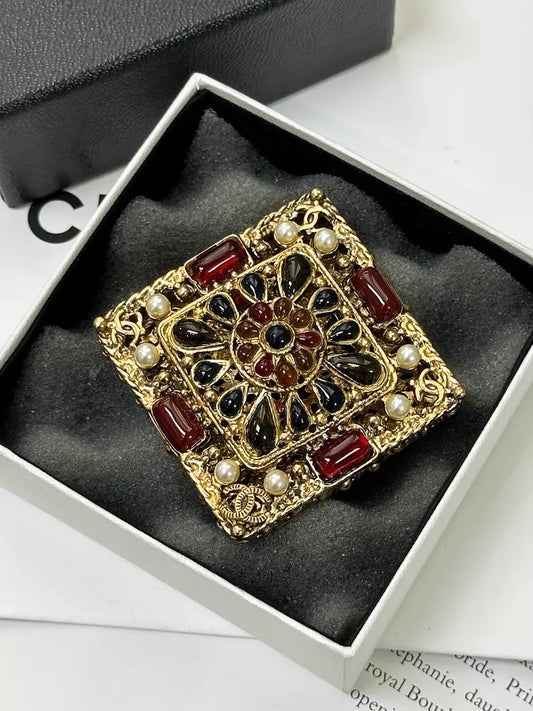 Chanel Byzantine gold square brooch with blue and red gemstones