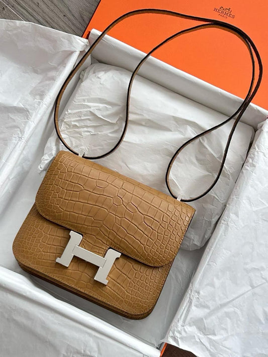 Hermès Constance crossbody bag in tan matte crocodile leather with palladium H clasp and thin shoulder strap