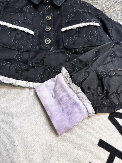 Chanel 22s black embossed double C logo jacket with purple gradient silk trim and two pockets