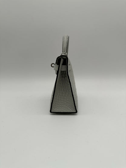 Hermès Kelly 20 Gris Neve Matte Alligator PHW K 2026