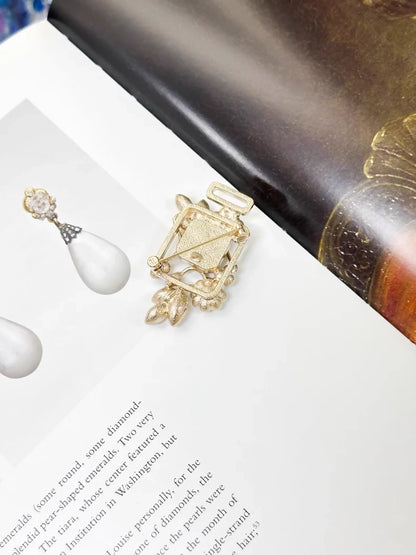 Chanel 22K pearl flower rhinestone perfume bottle glass jewelry brooch