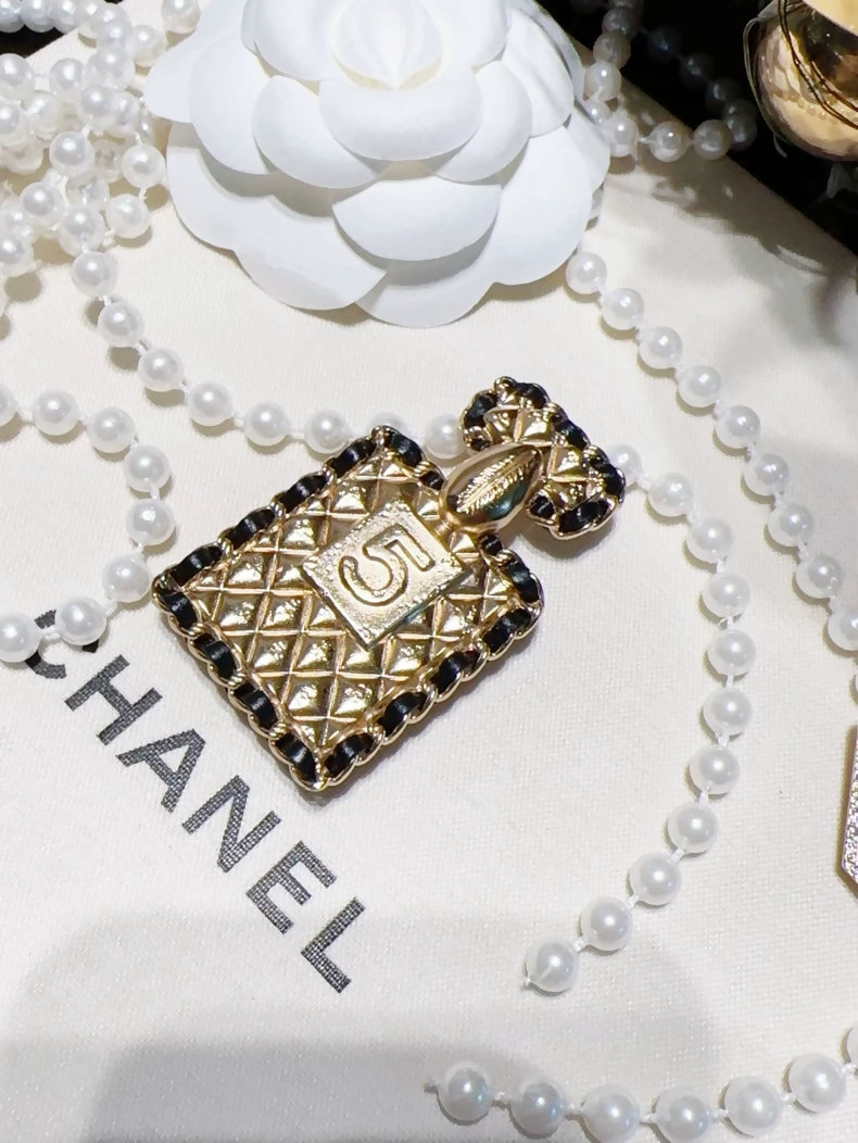 Chanel 23A quilted chain perfume bottle brooch