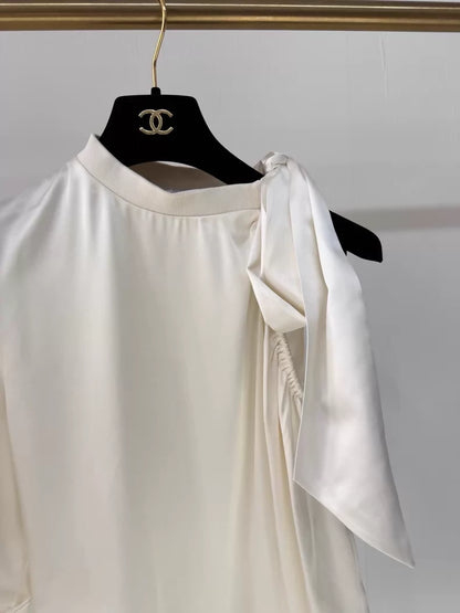 Chanel 24S ecru bow-tie satin off-the-shoulder blouse