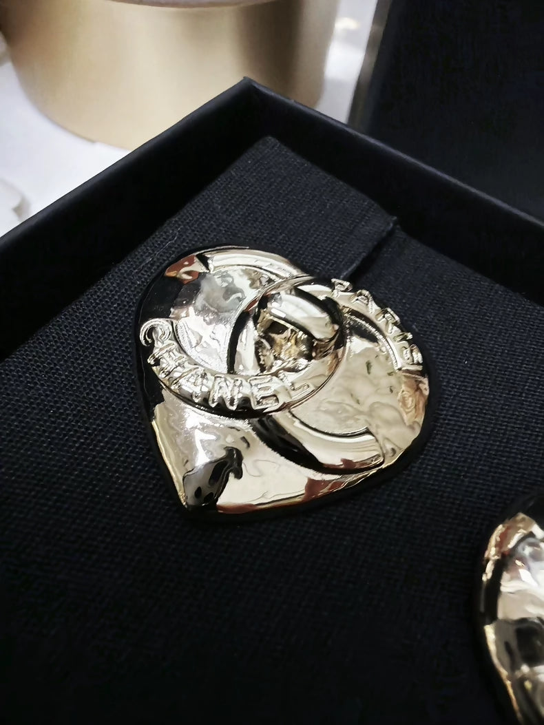 Chanel 22 light gold heart-shaped backpack clasp metal earrings