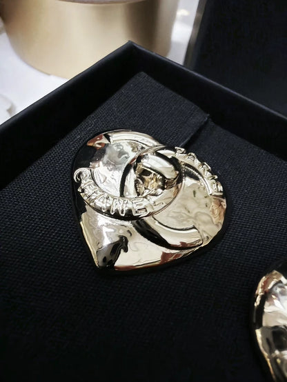 Chanel 22 light gold heart-shaped backpack clasp metal earrings