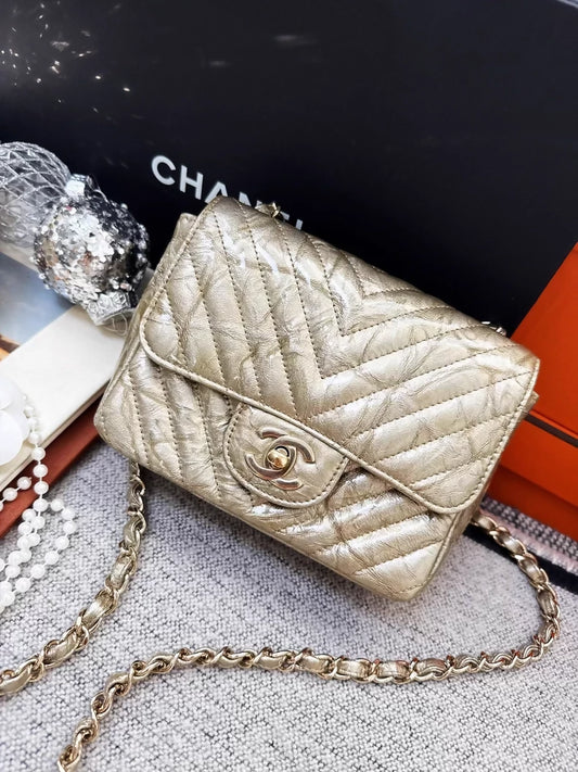 Chanel 2018 gold patent leather mini flap bag