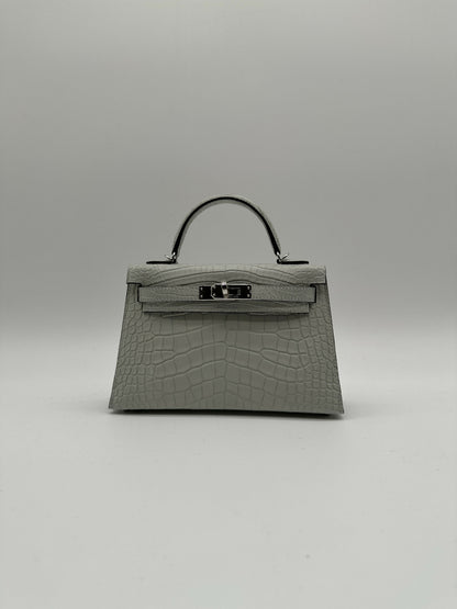 Hermès Kelly 20 Gris Neve Matte Alligator PHW K 2026