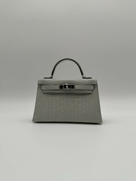 Hermès Kelly 20 Gris Neve Matte Alligator PHW K 2026