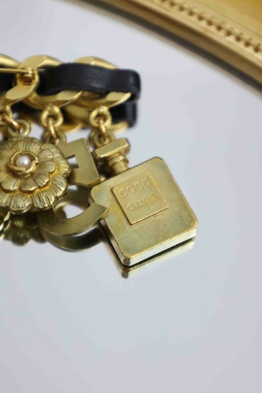 Chanel leather chain pendant brooch
