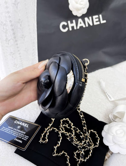 Chanel black camellia round chain bag