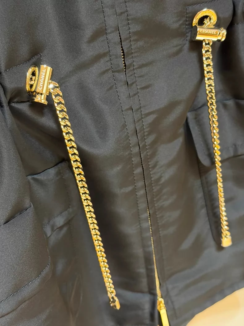 Chanel 23K black trench coat with gold chain details