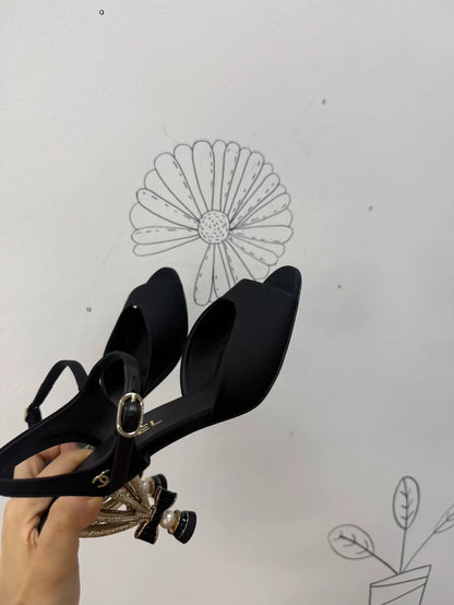 Chanel Métiers d'Art black and gold high heels with a stunning bow