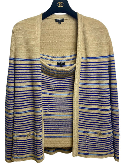 From the 2019 Cruise Resort La Pausa Collection by Karl Lagerfeld. Set Retail 5.5k Chanel Outfit in Metallic Striped Cardigan in Gold, Beige, and Blue Striped Linen Cashmere Blend with Matching Skirt. 2 Gold CC Buttons on Pockets and 2 on the skirt with