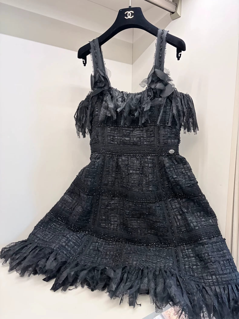 Chanel 2010 Black Dress plus camellia brooch