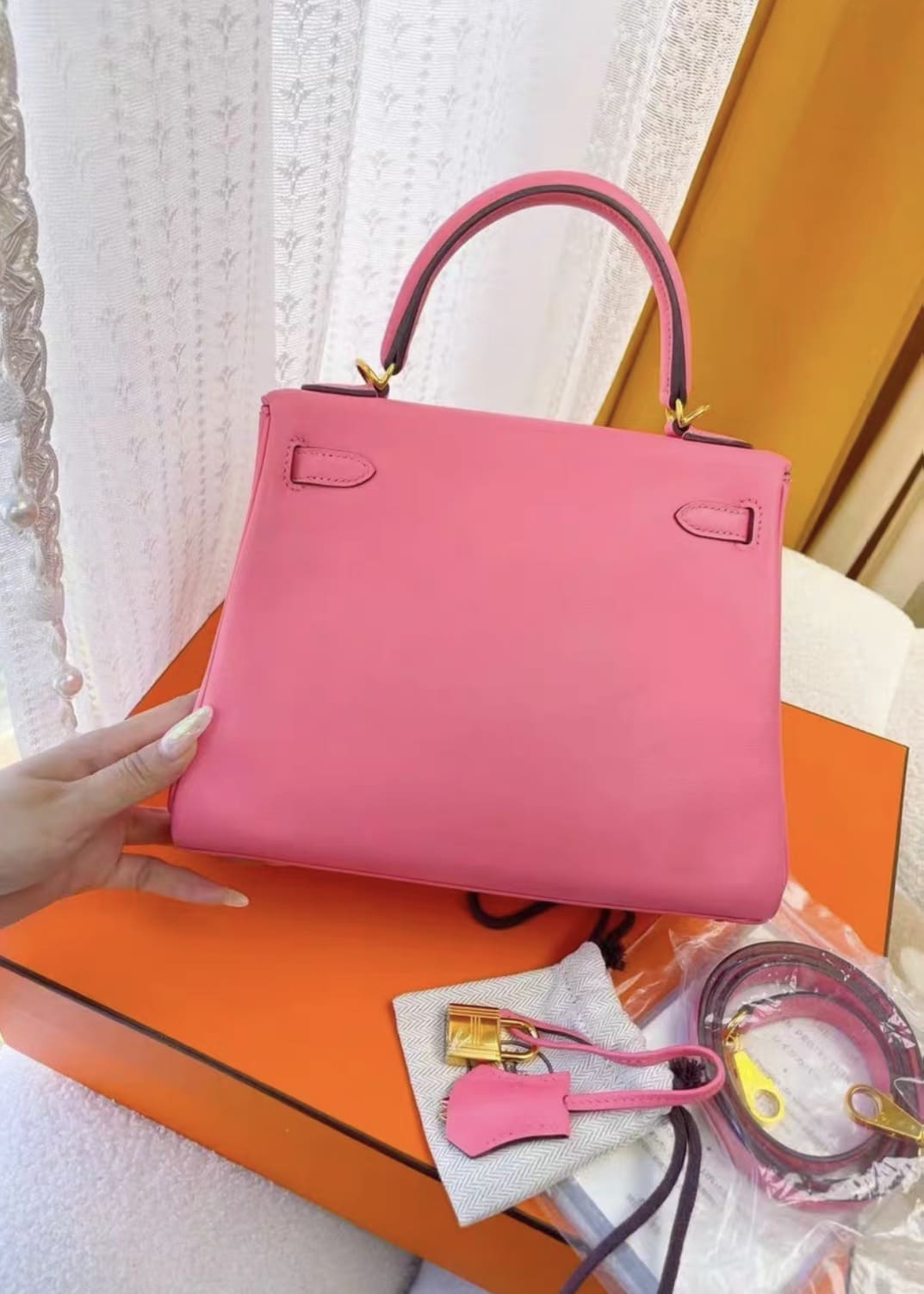 Hermes Kelly 25 pink Swift leather gold hardware