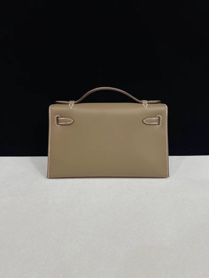Hermes Kelly pochette étoupe grey swift leather with gold hardware