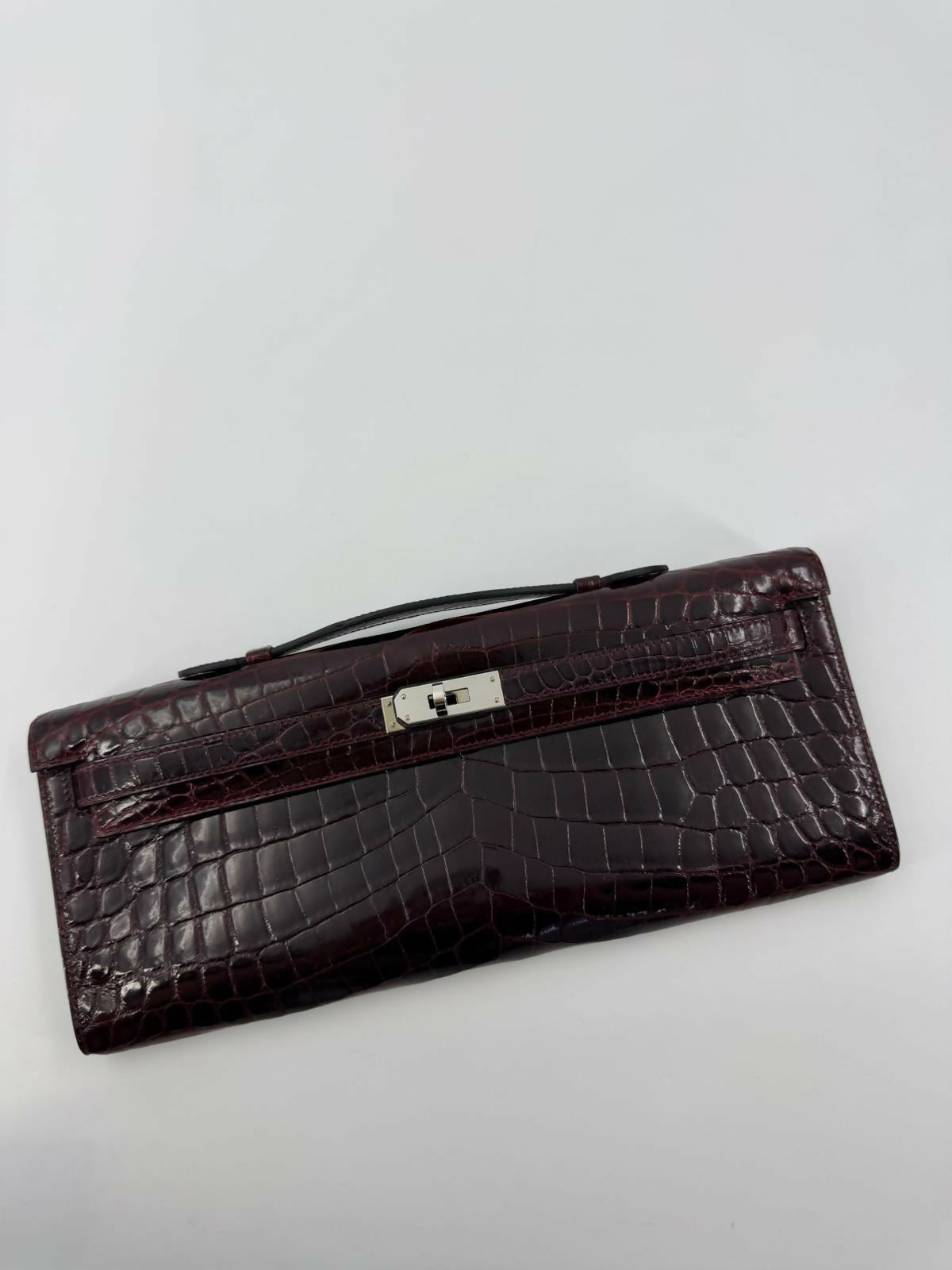 Hermès Kelly Cut Bag in Bordeaux Shiny Porosus Crocodile Leather with PHW