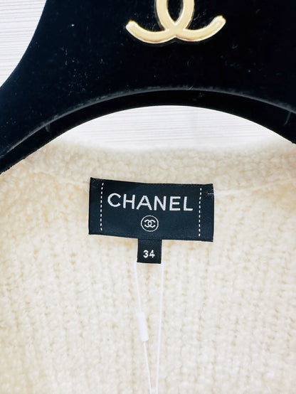 Chanel 24k off-white  knit top with ruffled sleeves and a V-neck