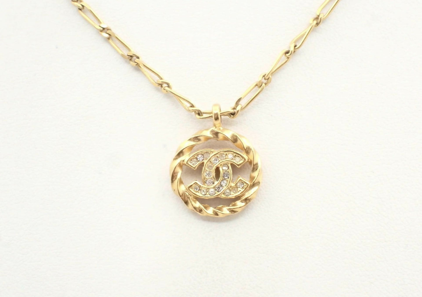 Chanel Vintage 1982 Rhinestone Gold Plated Braided Medallion Interlocking Coco Mark Necklace