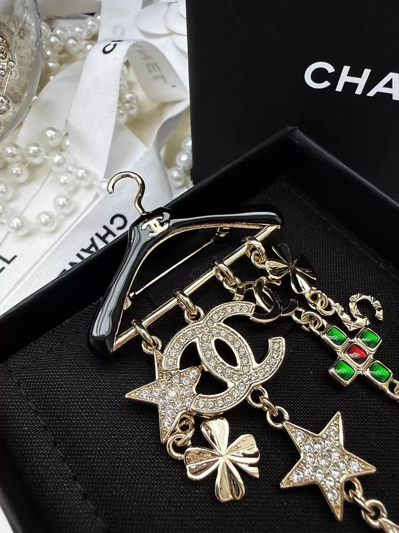 Chanel 23C black and gold hanger brooch