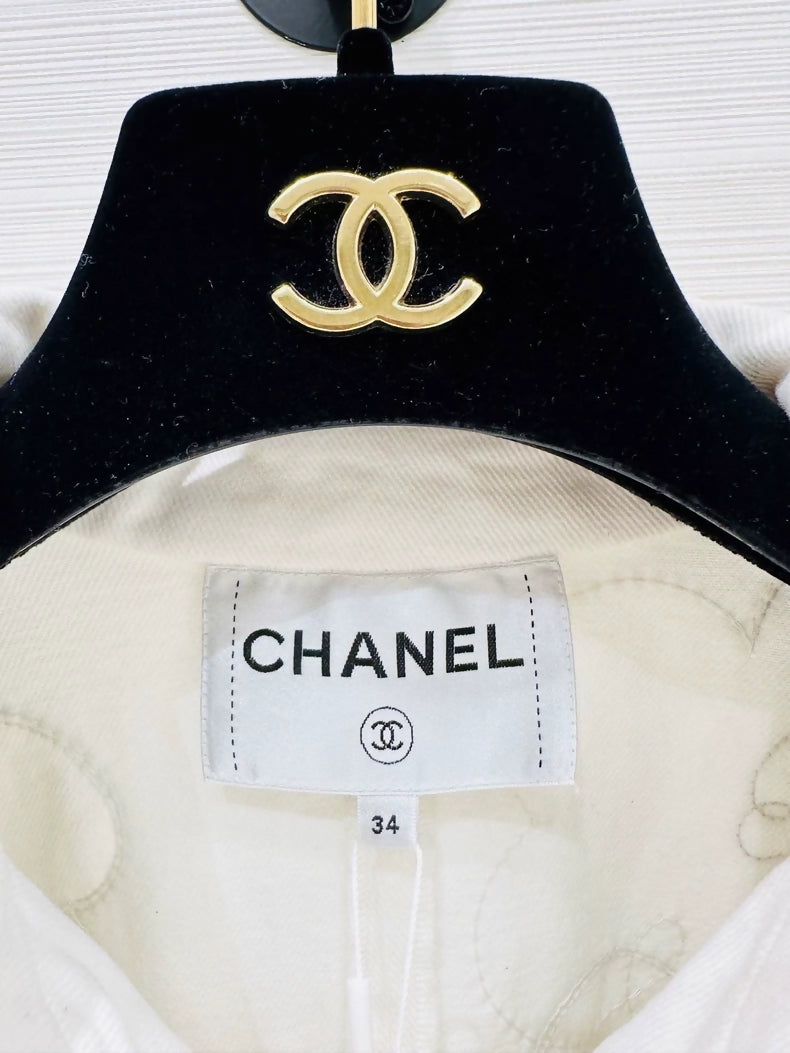Chanel Métiers d'Art white denim jacket with beaded camellia
