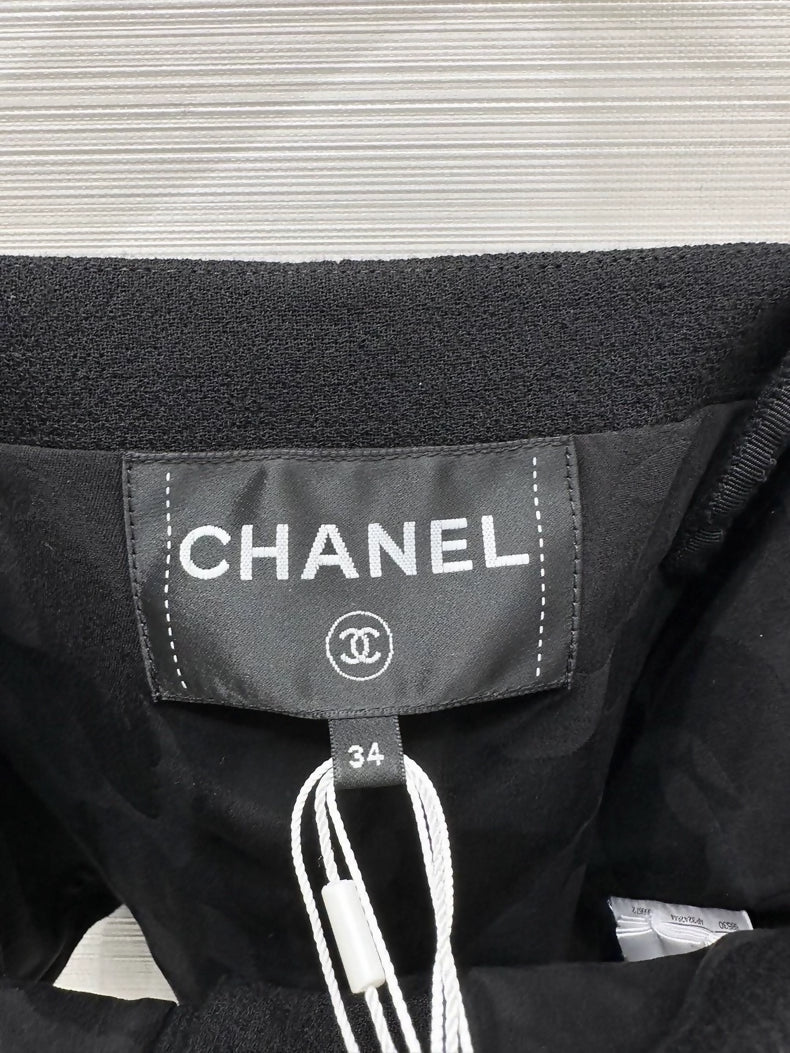Chanel 25b black top with pearls bow