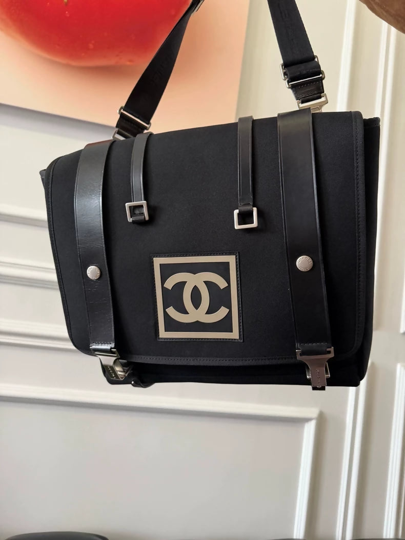 Chanel Sport Logo 3-in-1 shoulder bag adorned with a striking black and white logo