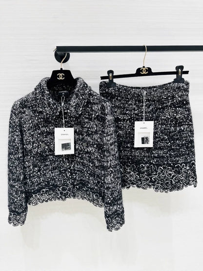 Chanel 25B black and white lace-trimmed cardigan and skirt set