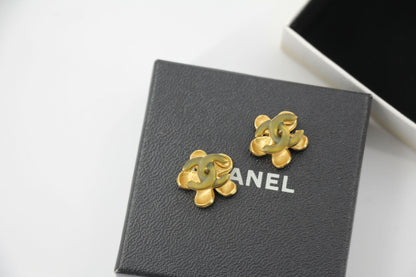 Chanel 03P Enamel Orange Five-Petal Flower Green CC Stacked Earrings