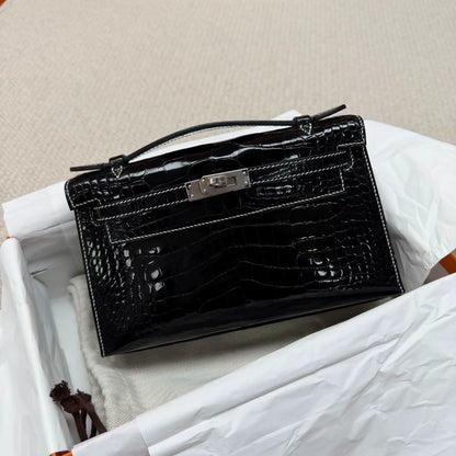 Hermes Kelly pochette black shiny crocodile leather palladium hardware