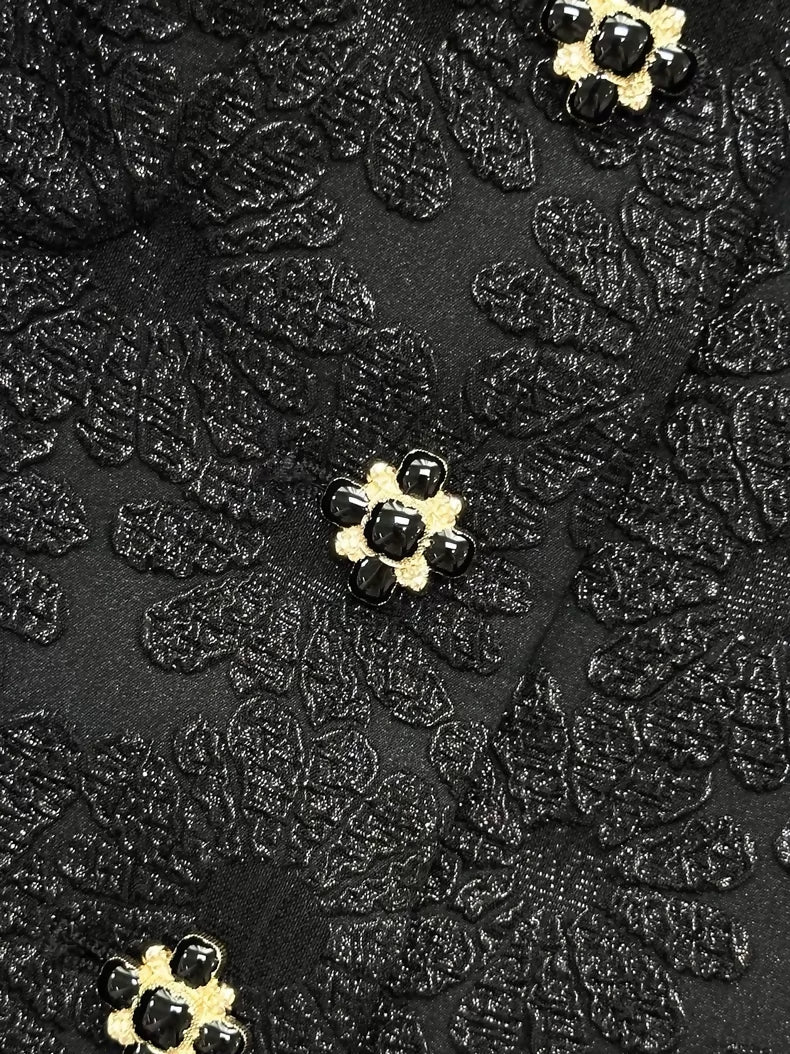 Chanel 21A black off-the-shoulder tweed jacket