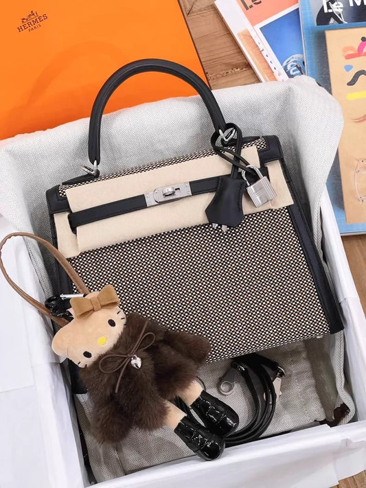 Hermès Kelly 25 black leather with brown and white embossed canvas palladium hardware