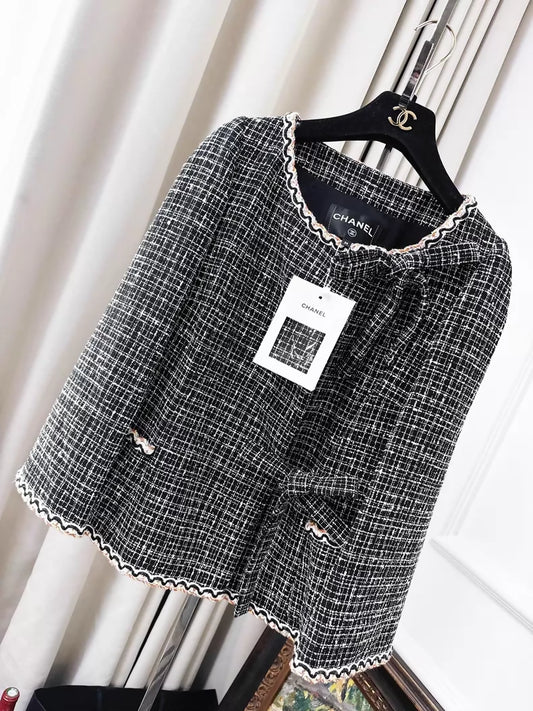 Chanel 25C black and white checkered jacket with side tie bow and colorful piping