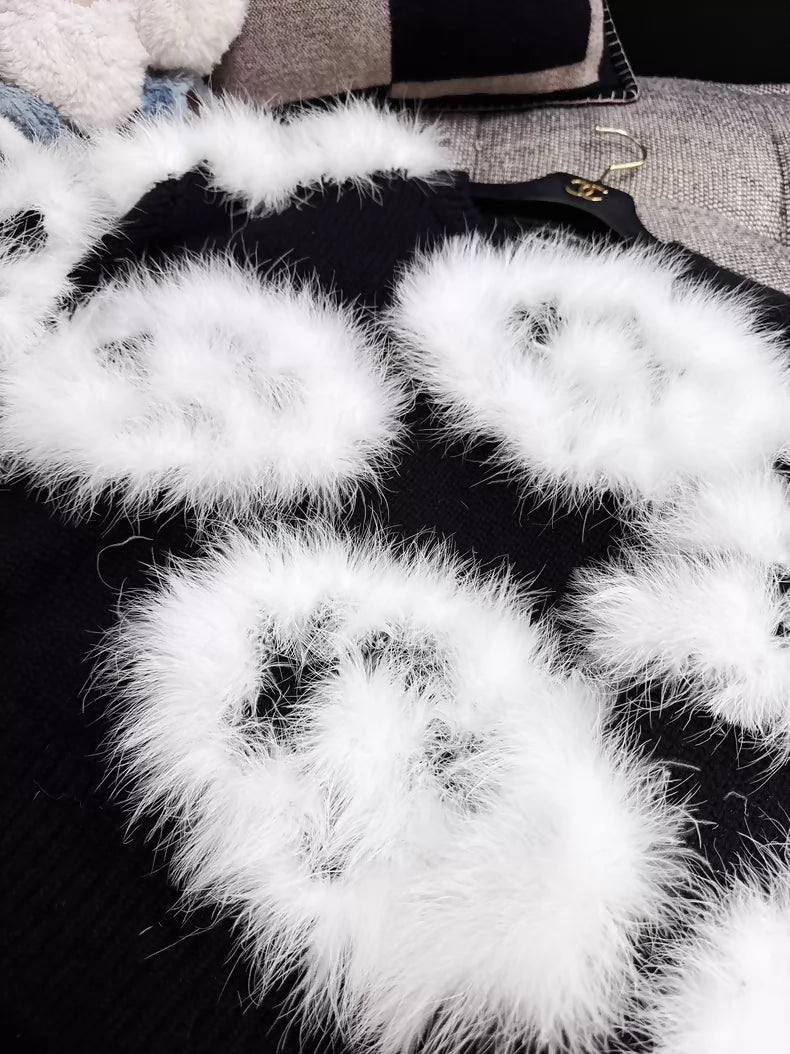 Chanel 23K white ostrich feather black camellia sweater