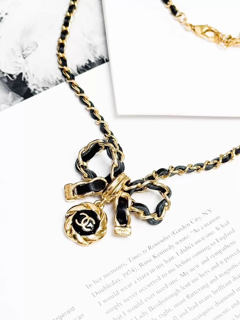 Chanel 22A  black and gold bow leather chain choker necklace