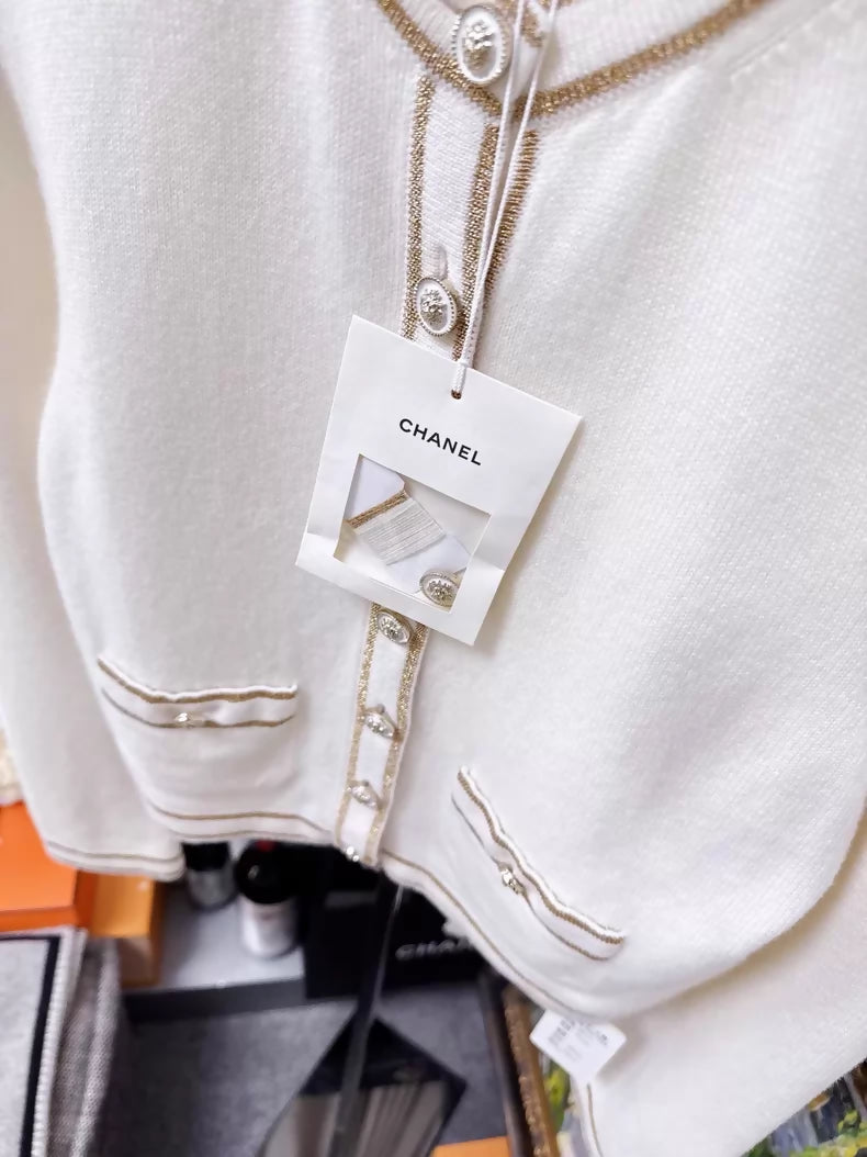 Chanel 26c white knit cardigan with gold trim and two pockets