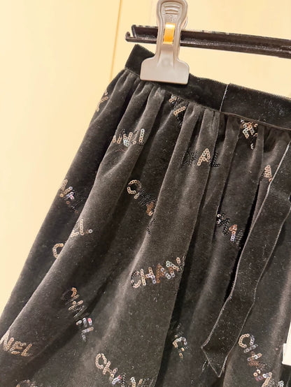 Chanel 22B Black Sequined Logo Bow Skirt