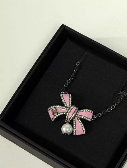 Chanel 25B pink bow pearl necklace