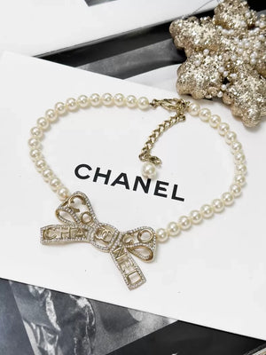 Chanel Fall/Winter 2020 Gold rhinestone bow pearl necklace choker
