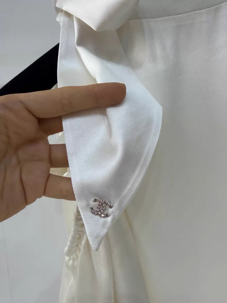 Chanel 24S ecru bow-tie satin off-the-shoulder blouse