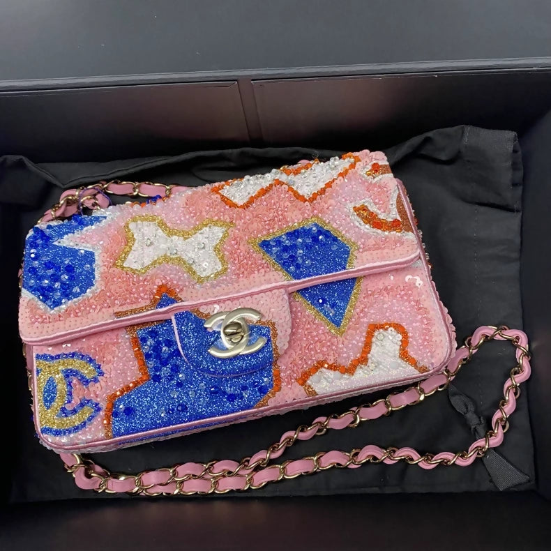 CHANEL 23A featuring colorful beaded sequins and heavy embroidery