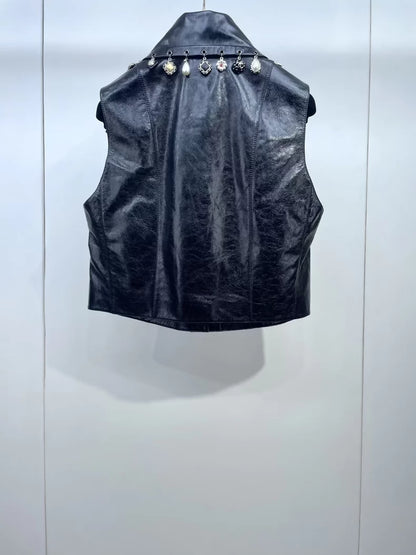 Chanel 24A black leather vest with charms