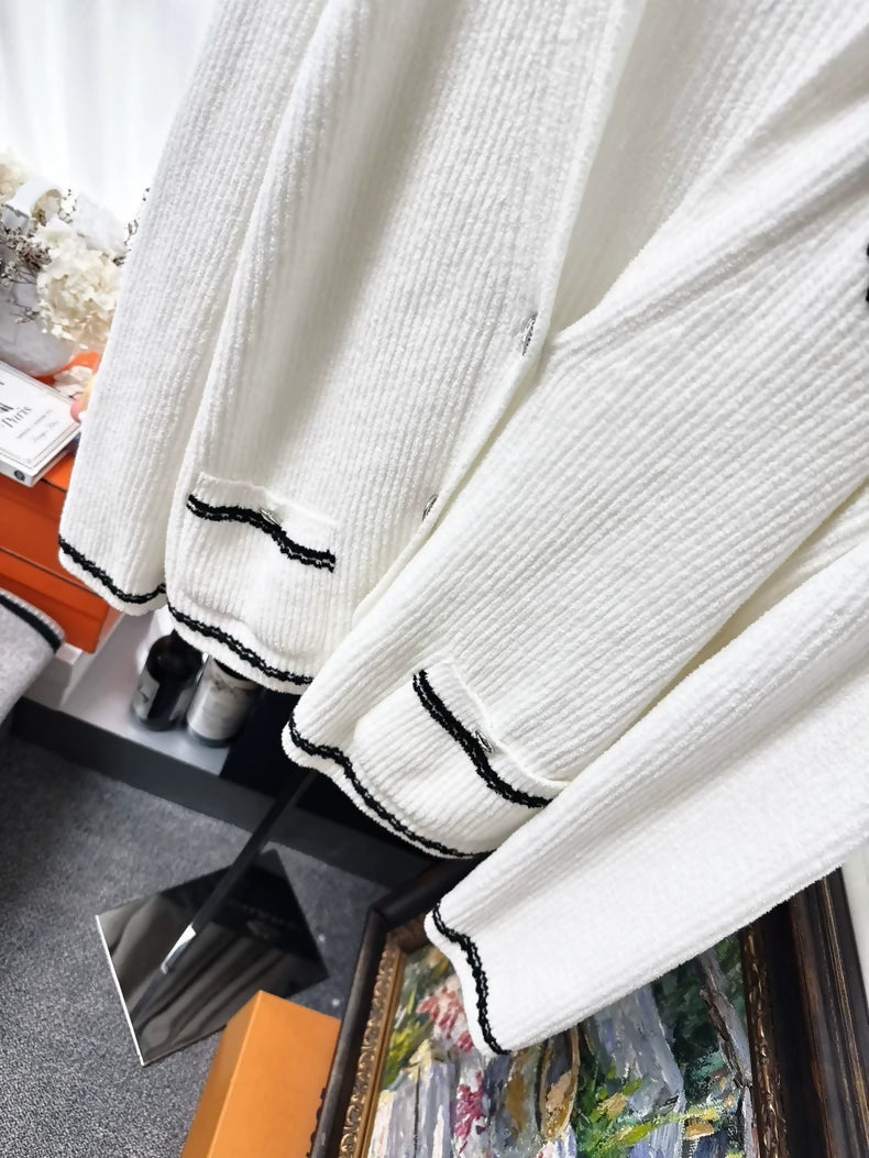 Chanel 23C white ribbed terry knit cardigan with black #5 beaded badge embroidered label