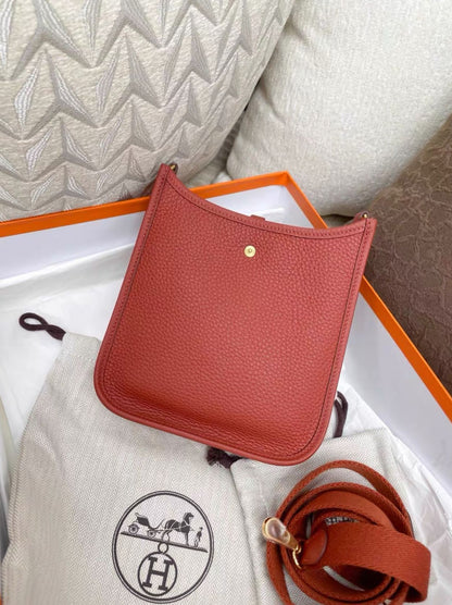 Hermes Mini evelyne brick red gold